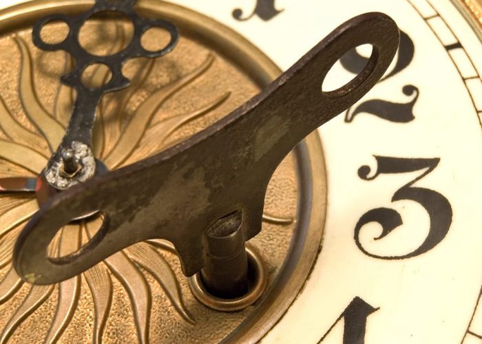 Old Fashioned Close Up Clock With The Key