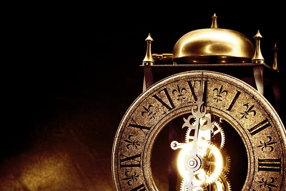 Antique Clock with bell on top on dark background